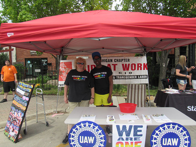 ill Daniels, right, with a member of Pride at Work Michigan, Photo by Micah Walker.