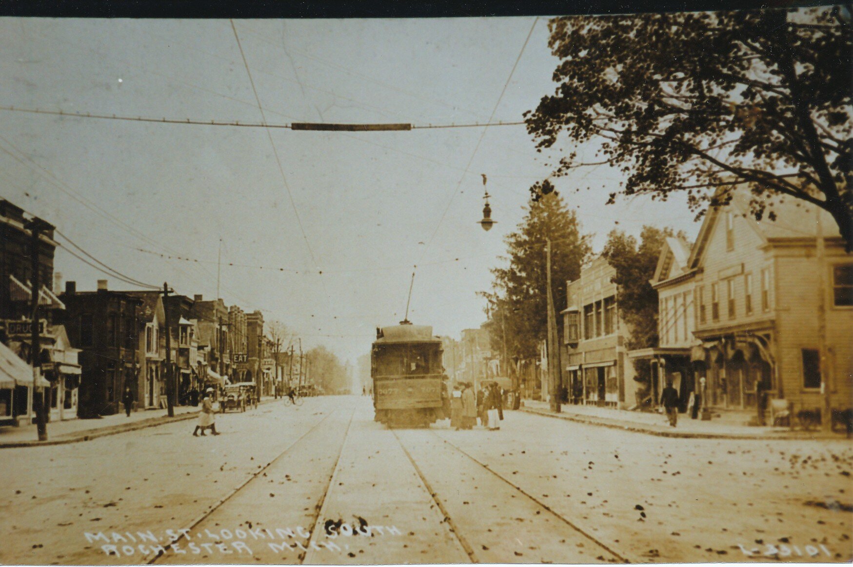 Looking south down Main Street at the Fifth St (now University Dr) intersection. The corner building on the right is the current location of Bean and Leaf.