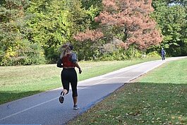 A runner hits the trail at Stony Creek Metropark.
