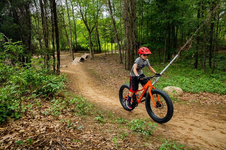 A young rider takes a spin at Stony Creek Metropark.