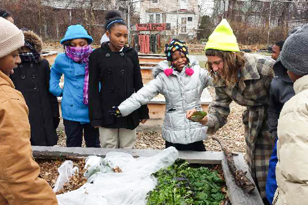 Young Detroiters learning about growing healthy food