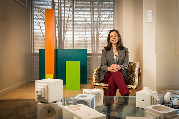 Leila Matta Art Programs Manager at Mercedes-Benz Financial Services, sits in a piece of functional art that is on display in the company’s headquarters lobby. All of the art shown here is on loan from students and graduates of Cranbrook Academy of A