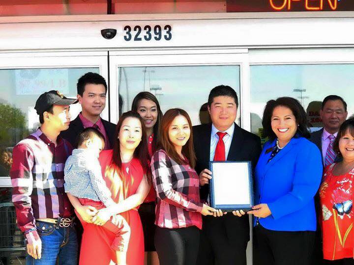 Ricky Dong and family celebrate the grand opening of 168 Asian Mart