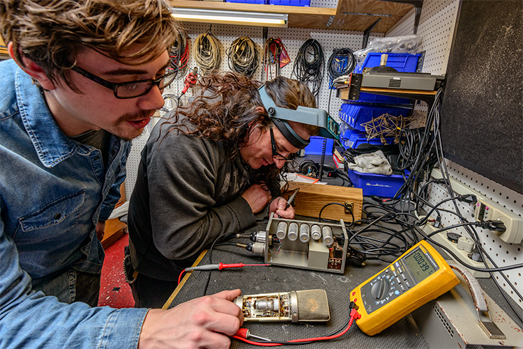 Technicians repairing equipment at Vintage King Audio in Ferndale