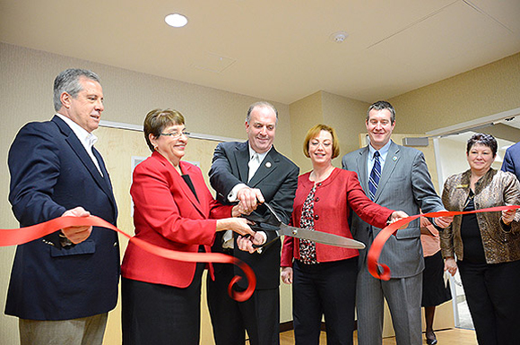 Cutting the ribbon at Baker College. 