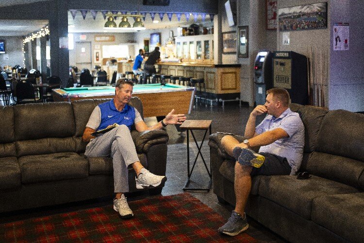Frick's Sports Bar Co-owners Jeff Rekeweg, left, and Kurt Busard, right, chat about restaurant business during their weekly meeting on Wednesday, Aug. 2, 2023 at the restaurant in Midland.