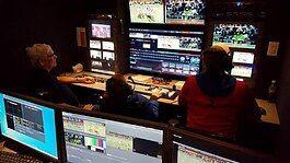 Production crew inside MCTV's production trailer capturing high school football.