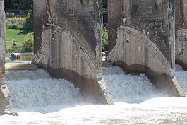 Redirecting the river back through its original channels – through spillways at the dam – is another aspect of dam stabilization.