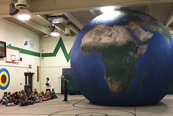 Students at Interlochen Elementary learn about geography as well as environmental issues though the Earth Dome balloon.