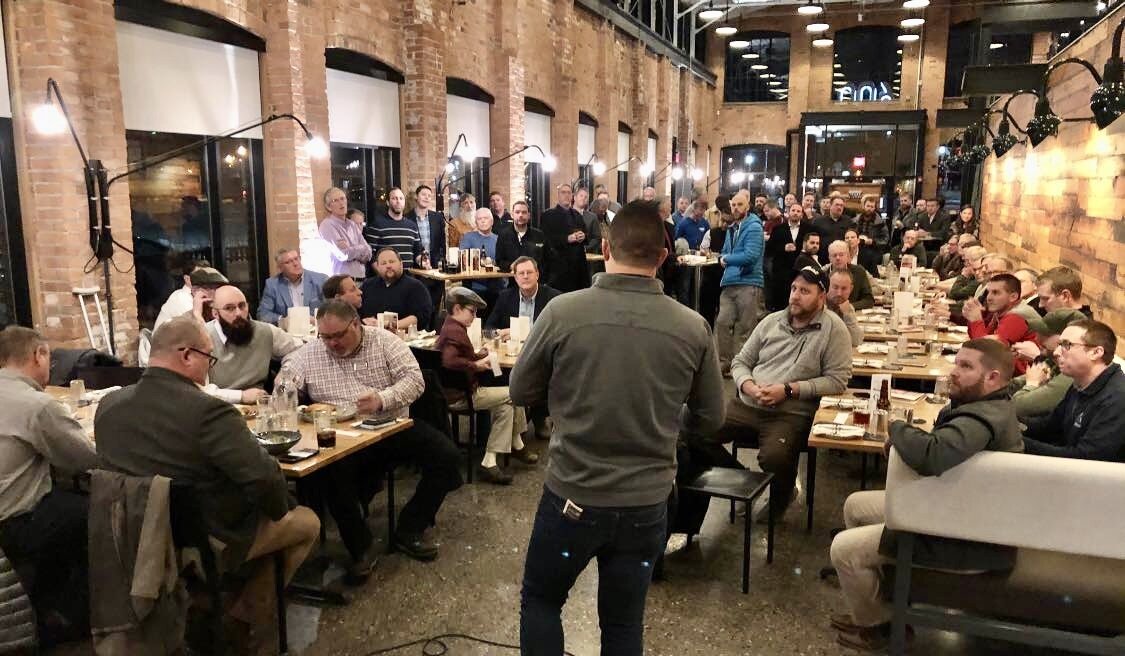 Cody Livingston leads a meeting of Guys Who Give at a 2019 meeting at 600 Kitchen and Bar in downtown Kalamazoo. Courtesy photo