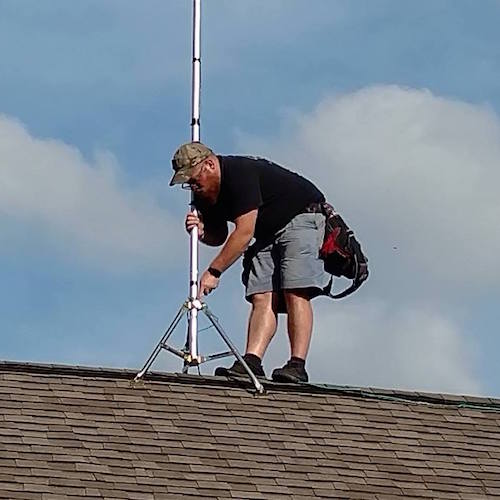 An installer for Aeorn Wireless up on the roof