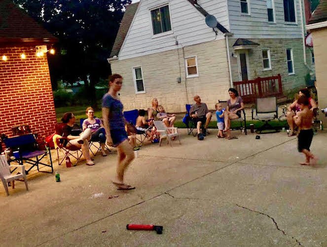 Neighbors gather in the Solesbees’ backyard for Fourth of July fireworks.