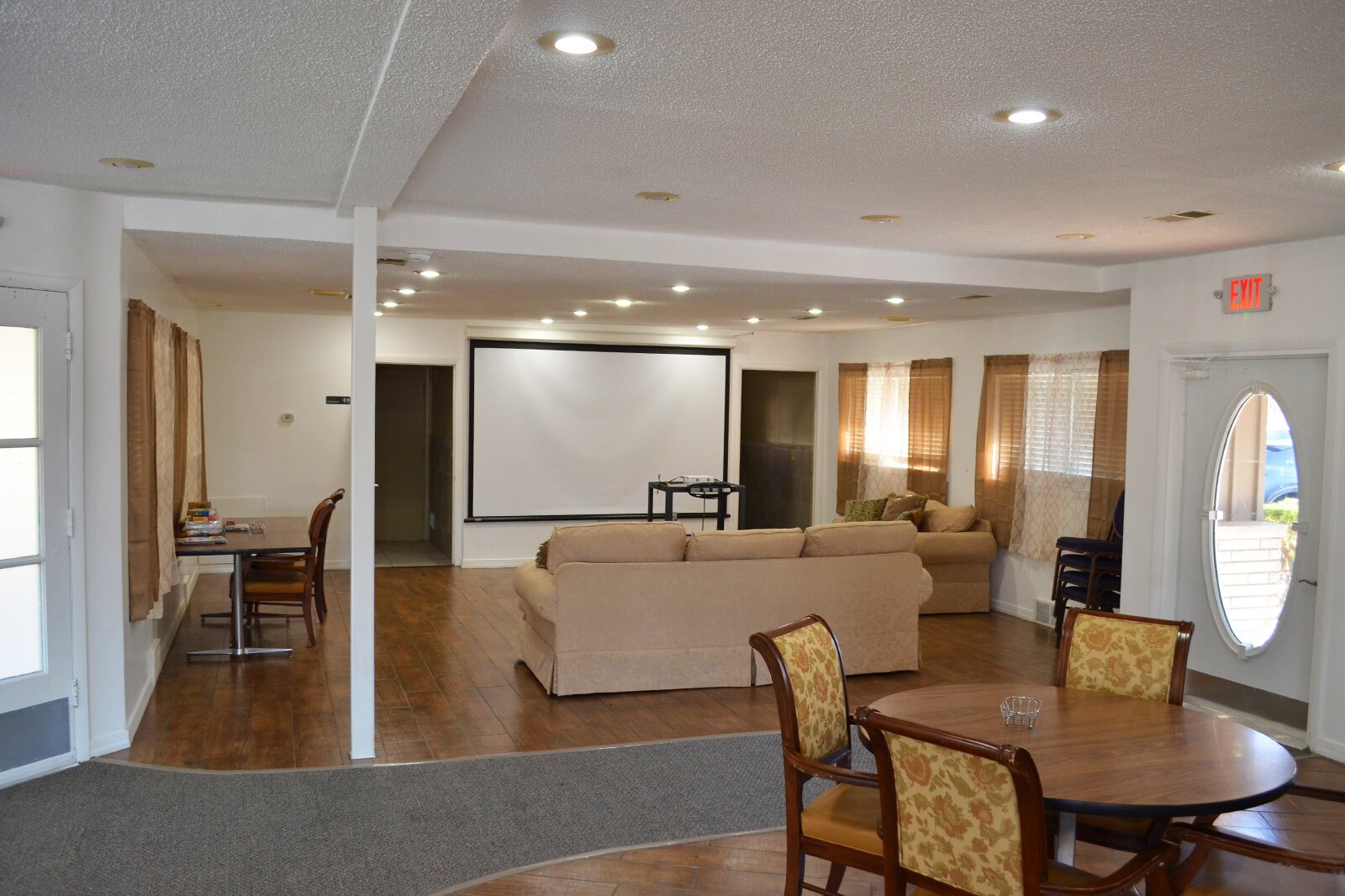 The main area of Thrive features comfy couches, tables to play games and eat, and a projector.