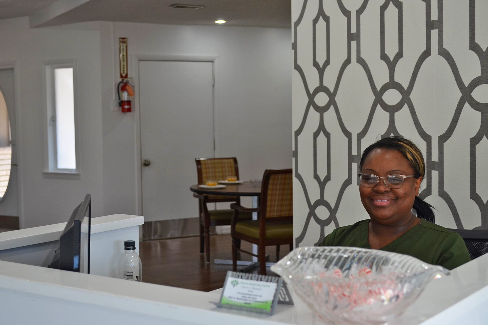 Thrive founder and owner Sarita Alexander sits smiling, ready to welcome new patrons. 