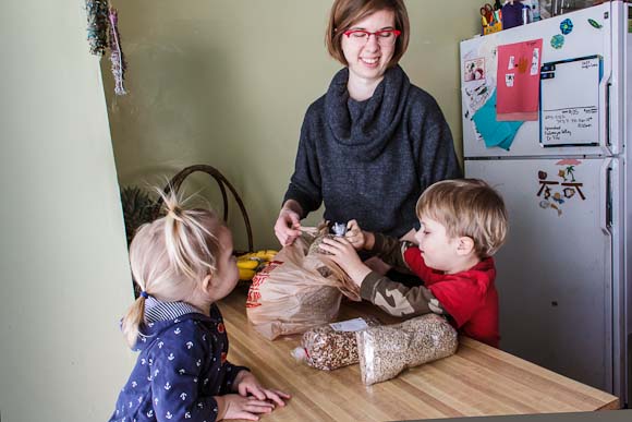 Steena Brown unpacks groceries with children Viggo and GloryAnne