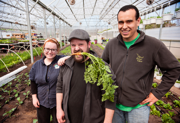 Jeremy Andrews, CEO of Sprout Urban Farms with employees Rebecca Spicer, left, and Devon Gibson, right, inside their greenhouse in Battle Creek, Michigan. 