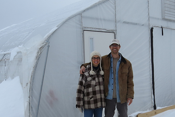 The Thompsons at one of their hoop houses.