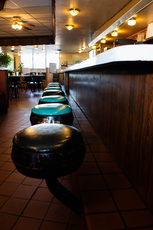 Generations of customers will recognize the familiar seat at the counter of Speed's in Ubrandale. Photo by Erik McCloud