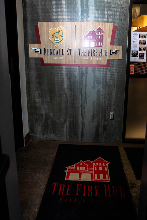 Visitors are greeted with clearly marked directions in the building that is both a restaurant and a food pantry.