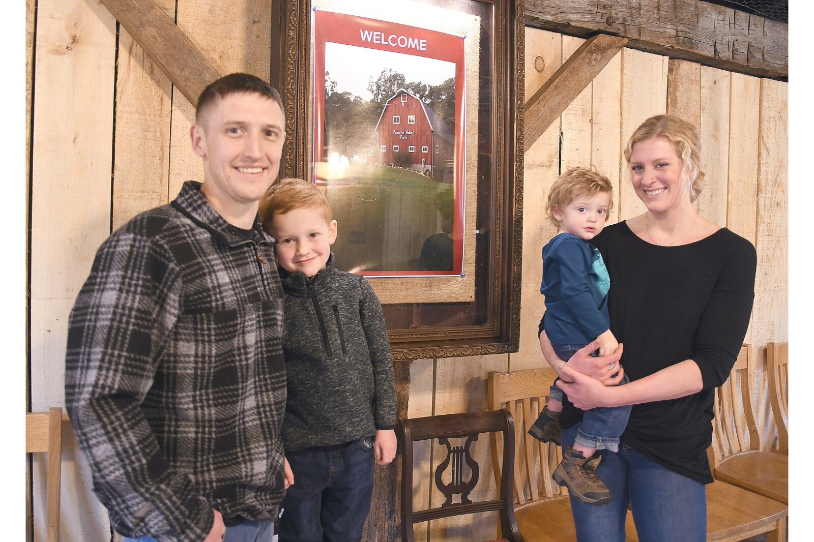 Cody and Terin Warner are the new owners of the barn and property. They are seen with their sons, Chase, left, and Noah.