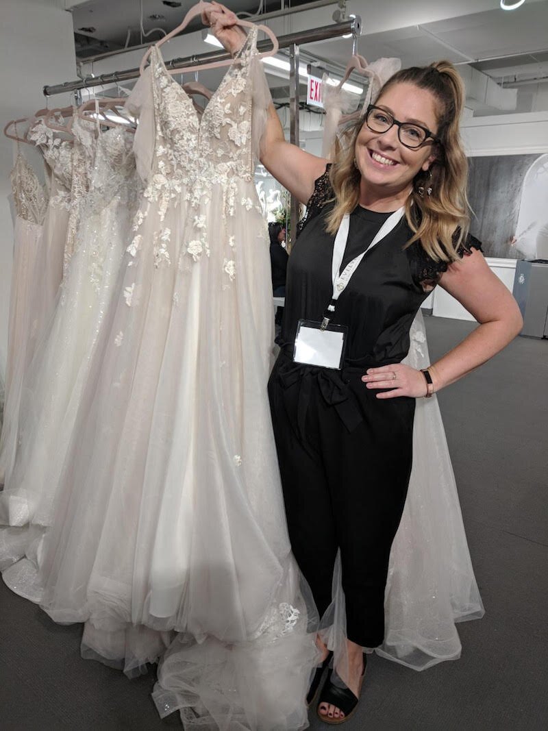 Store manager Kelsey Klug is shown at Memories Bridal & Evening Wear in Kalamazoo after a purchasing trip last fall. The store purchased all of the its wedding gowns for this spring season.