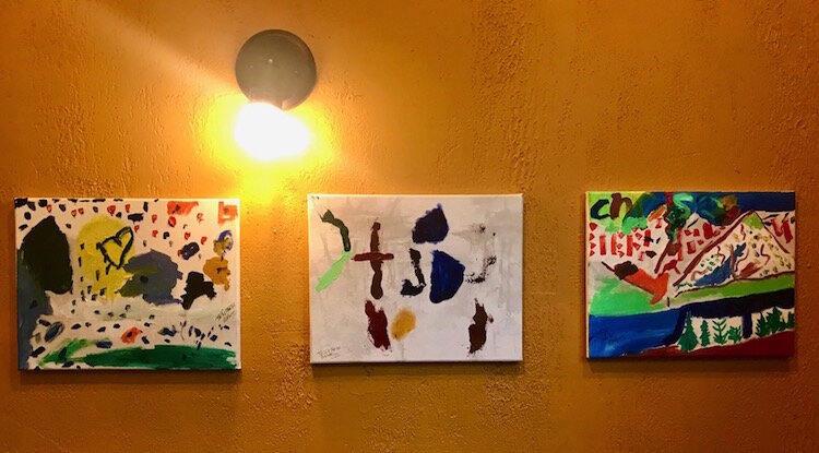 These are three paintings by Kristen McKinney, the 5-year-old daughter of restaurateur Chrissy McKinney.