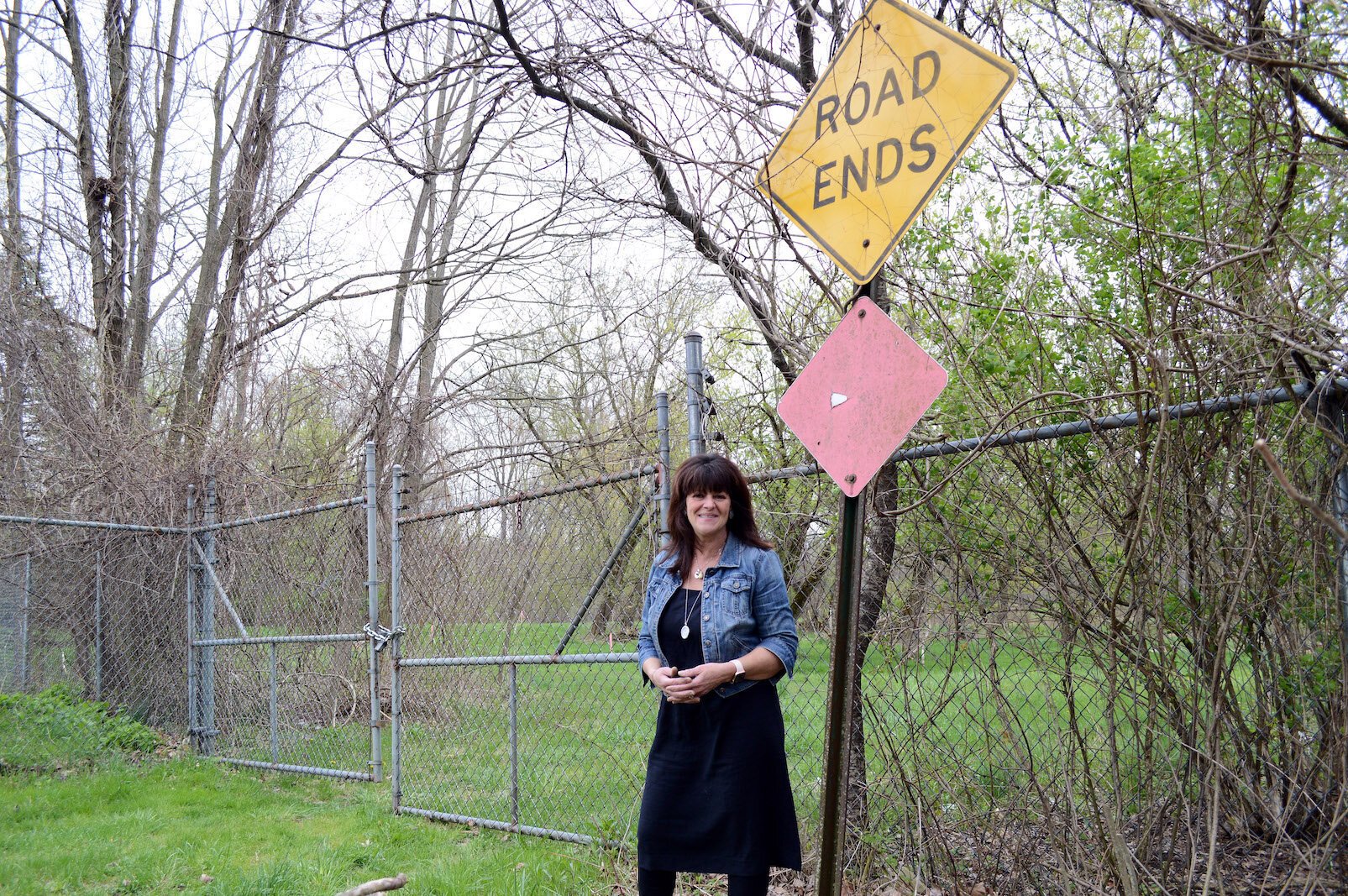 Galesburg mayor Lori West in the spring of 2019, standing were the KRVT was planned to go onto land near the Kalamazoo River. 