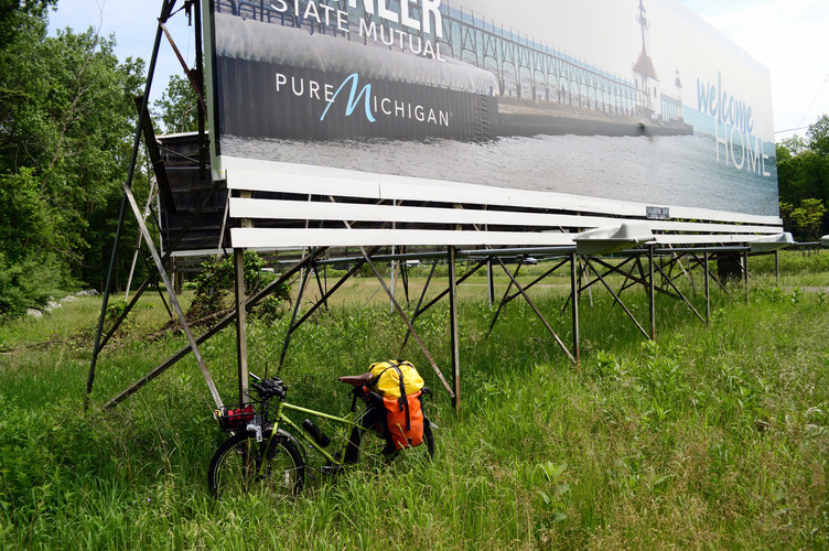 Bike’s-eye-view of Pure Michigan billboard meant for I-94 drivers who’ve just crossed over from Indiana.