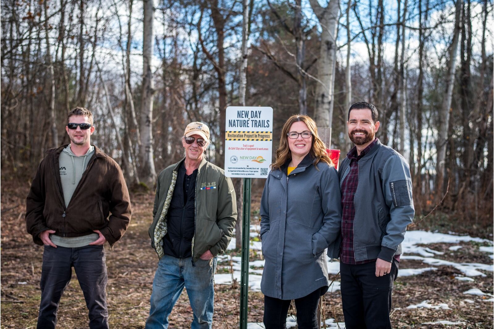 Ken Kesson, DNR Wildlife Biologist who is overseeing the project, neighbor Nate VandenBos, and New Day Co-Pastors Bill and Marilee Menser are enjoying each stage of the New Day Nature Trails restoration process.