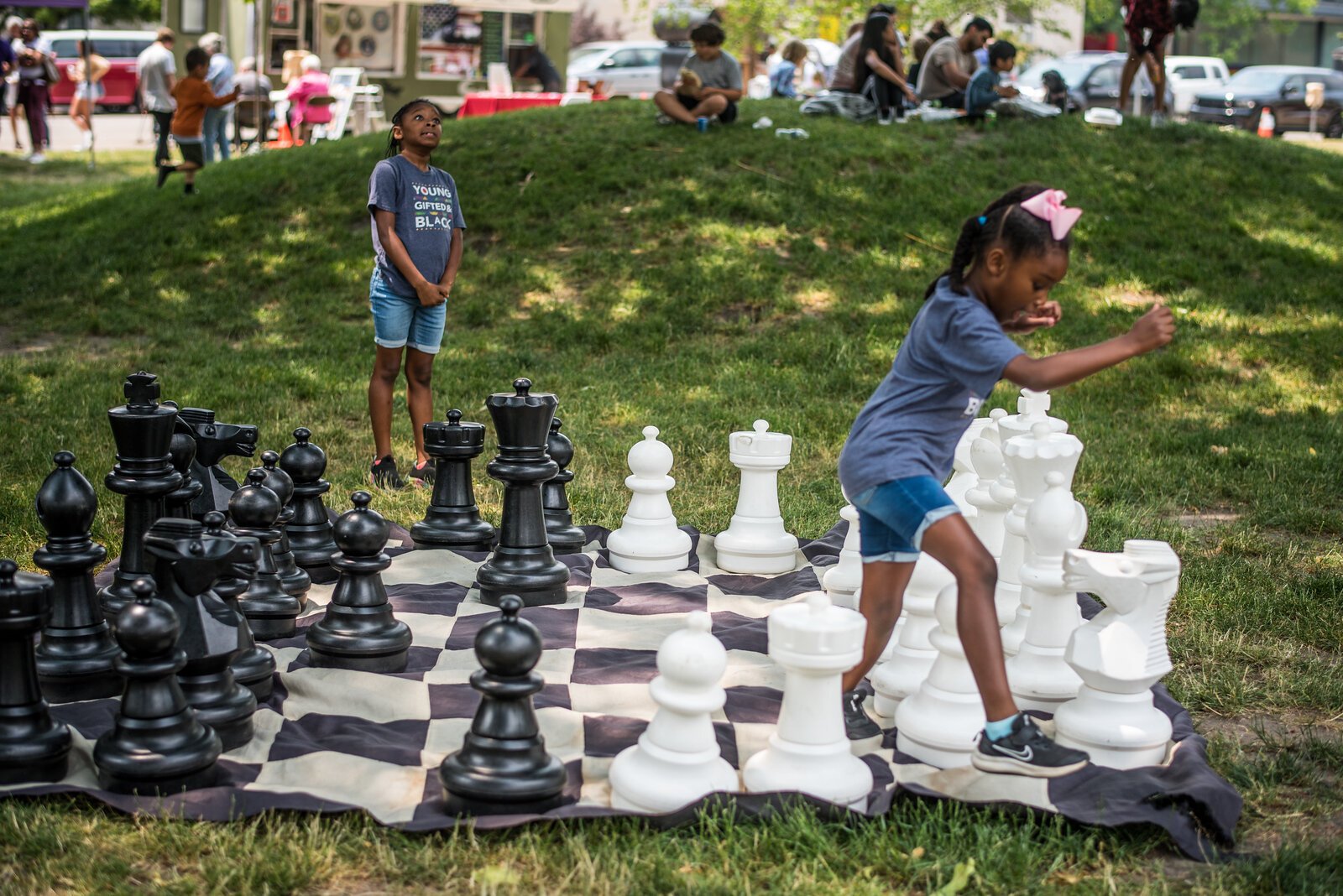 In Bronson Park in June, Fran caught these youth playing a game that was part hopscotch, part chess.