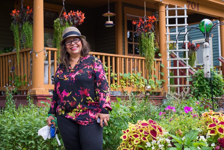  Martha Gonzalez' home on Cedar Street is a car-stopper with its vibrant gardens and welcoming porch.