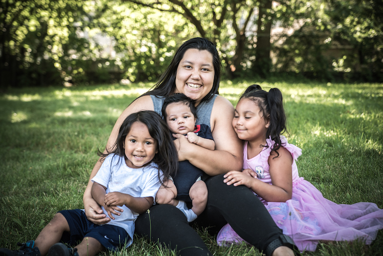 Perla Castaneda with her children, Jerome, Giovonni, and Kymberlee. Photo by Fran Dwight.