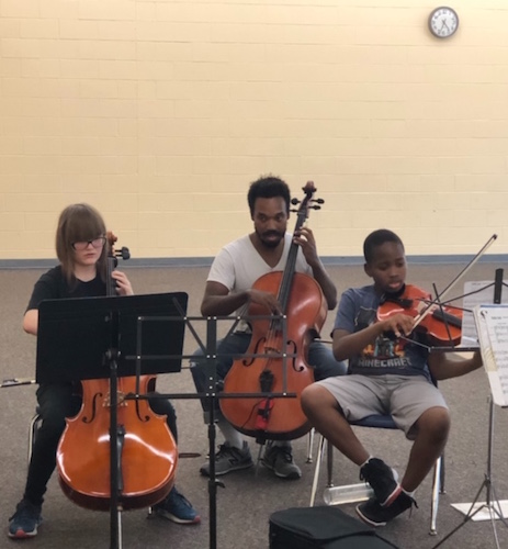 The Helen Fox Gospel Music String ensemble performed recently with their teacher, cellist Jordan Hamilton, at the Douglass Community Association's community room.