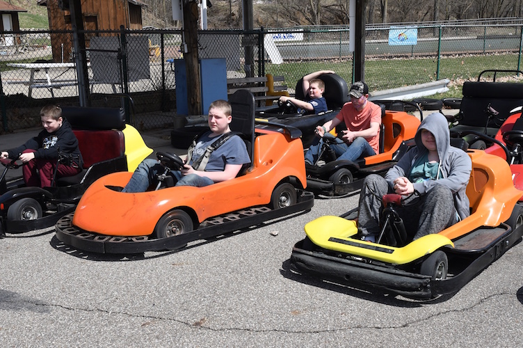 Kids eager to take Go-Karts for a ride.