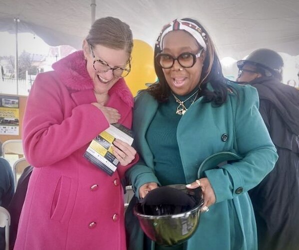 Kalamazoo Assistant City Manager Rebekah Kik, left, shares a moment with HOPE Thru Navigation leader Gwendolyn Hooker, at the April 4, 2024, for groundbreaking of the Tiny Houses of Hope.