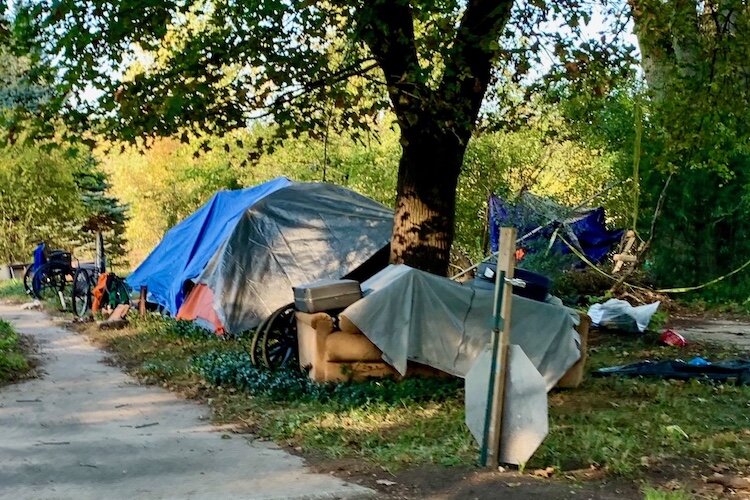 A proposed community of modular housing pods is expected to be a safer alternative to homeless encampments that sprung up near downtown Kalamazoo like this one shown in October of 2021.