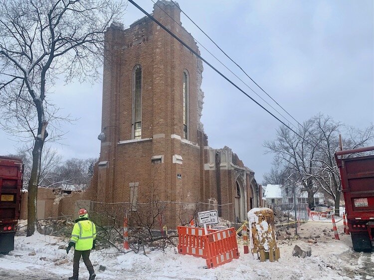 A demolition crew works to tear down the bell tower of the former North Westnedge Church of Christ on Jan. 18, 2023 in Kalamazoo.