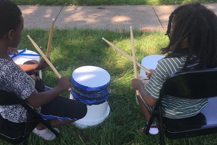 At Mt. Zion Church's community cookout at Interfaith Homes on the Northside, Rootead provided drumming and free books, courtesy of the Great Start Collaborative.