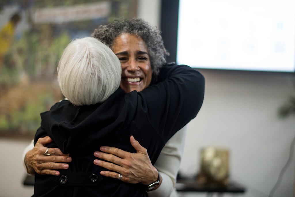 Elizabeth Washington, new executive director of the NACD, gets a warm hug at NACD’s March 1, 2024 open house.