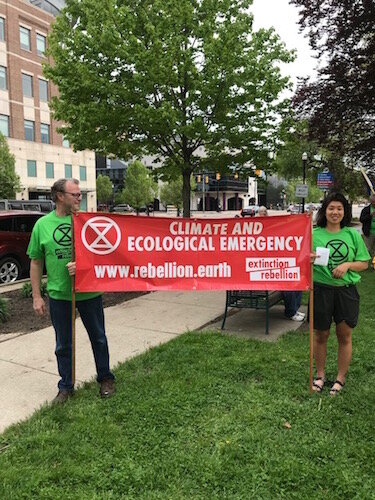 In Extinction Rebellion's first action, members participated in a march from Bronson Park to the Radisson Hotel.