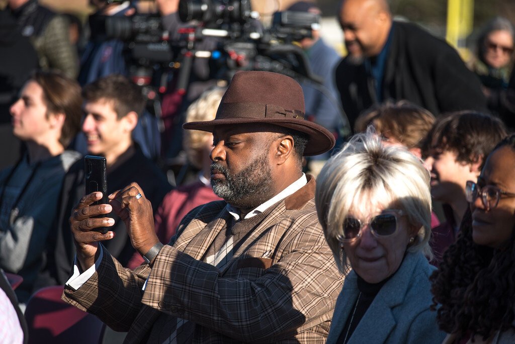 School Board trustees Jermaine Jackson, with hat, and Patti Sholler-Barber, at right, were among about 200 people to attend the Nov. 14, 2023 dedication of new ball fields at Kalamazoo Central High School.