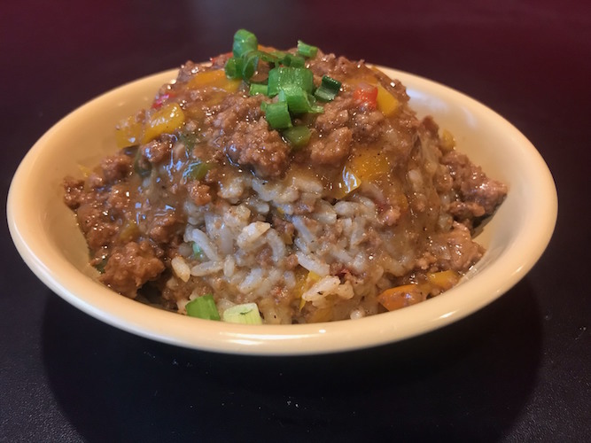 Cookie's Dirty Rice is a popular choice: white rice 'dirtied with meat,' peppers, gravy and the holy trinity, a Cajun spice trio.