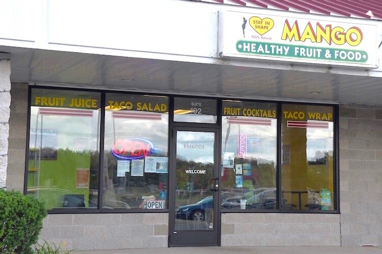Store front of inside Mango Healthy Fruit and Food at Columbia and Helmer.