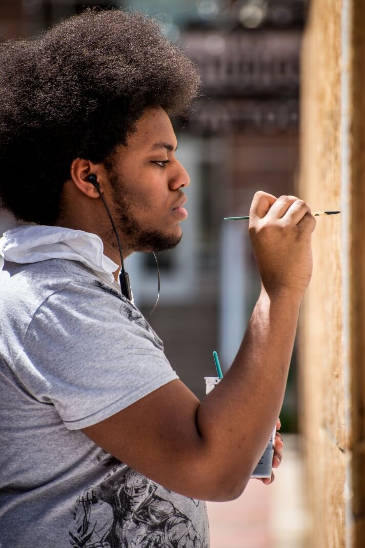 Artists converged on downtown Kalamazoo Saturday and Sunday to turn boarded up storefronts into art spaces.