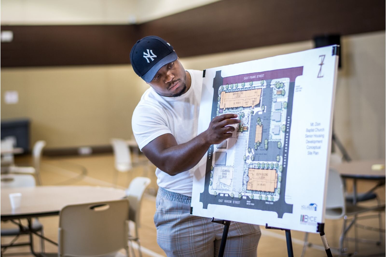 Jamauri Bogan, an associate developer working for Hollander Development Corp., points out features of Mt. Zion’s affordable senior housing complex during a July 21, 2022 community input session.