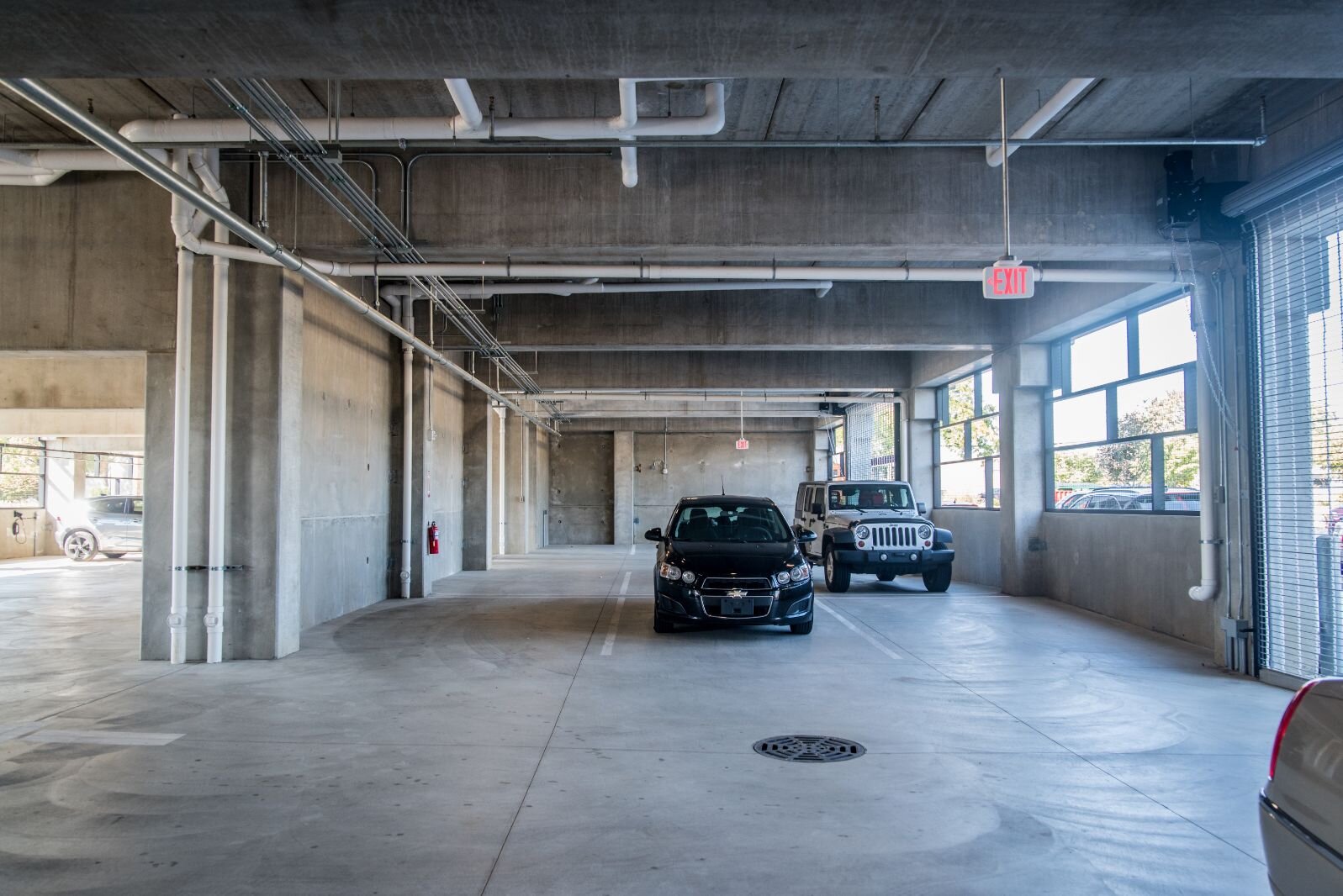 Indoor parking is available on the ground level of the residential/commercial development.