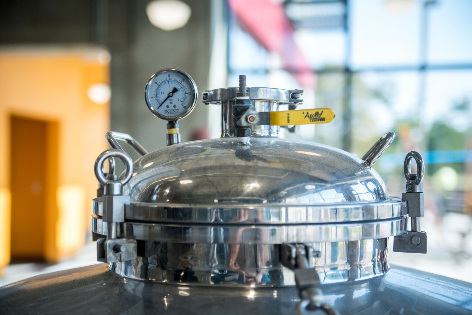 The top of a fermentation tank is seen inside the Brewery Outre, a microbrewery and tap house that is soon to open on the ground floor of the Harrison Circle Apartments building.