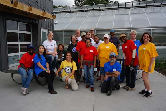 Pfizer volunteers work at Riverview Launch