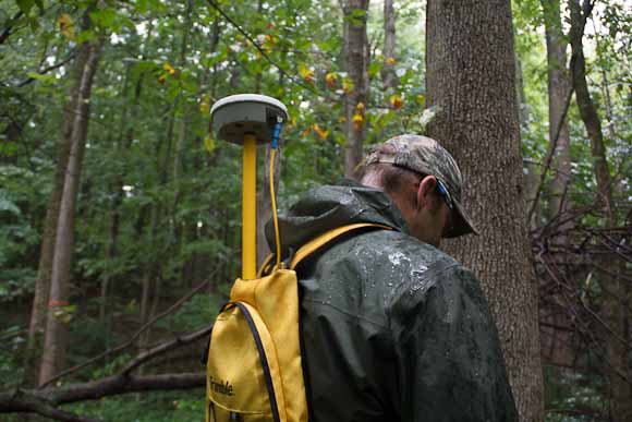 Vic Bogosian, natural resources manager records location data from antenna in backpack