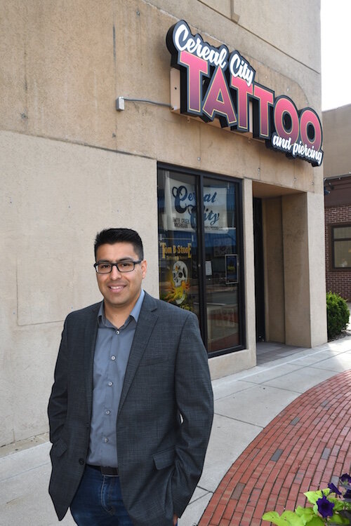 Israel Flores of Northern Initiatives, in front of Cereal City Tattoo and Piercing in downtown Battle Creek.